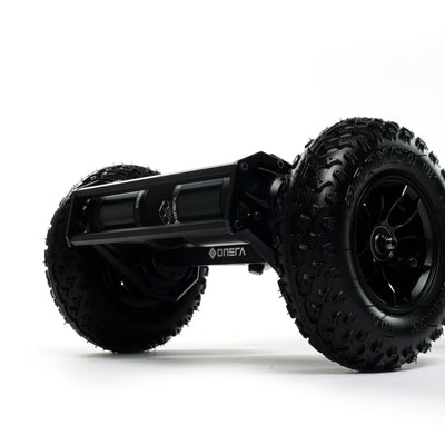 ONSRA BLACK Carve 4 premium electric longboard with a flexible bamboo deck, Gear Drive drivetrain, 14S battery, precision trucks, and all-terrain wheels, shown in a side profile.